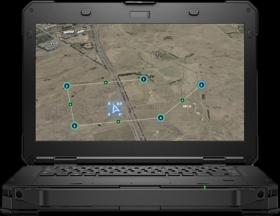 Juno on a rugged laptop, front on: a five-point mission route over farmland beside a highway, with the aircraft's position marker