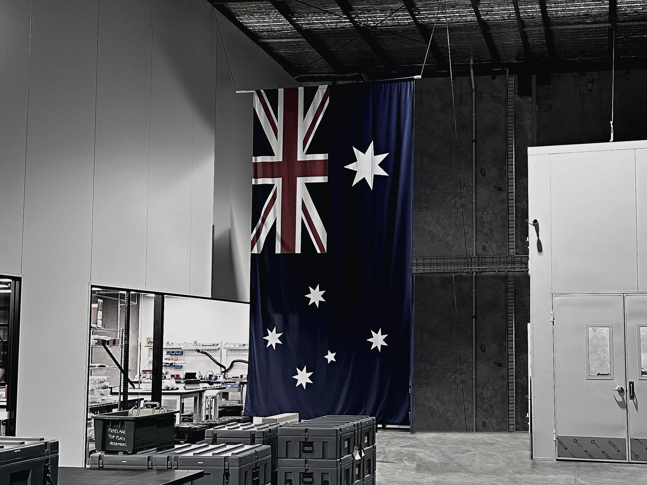 The Freespace factory hall in Australia, a large Australian flag hanging from the roof trusses